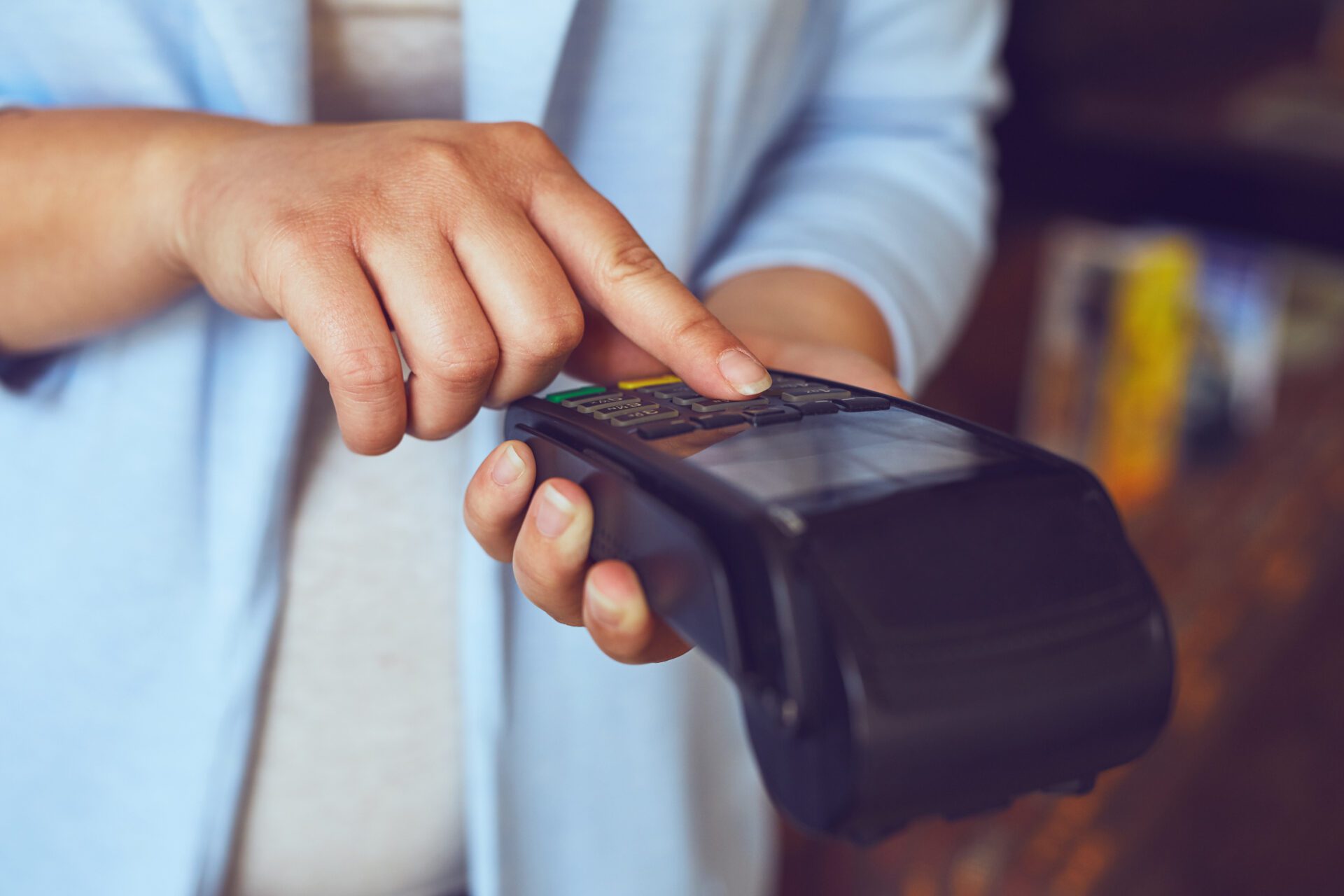 female hands entering pin number